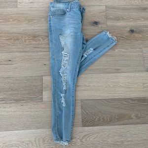 Mid Rise light wash distressed jeans